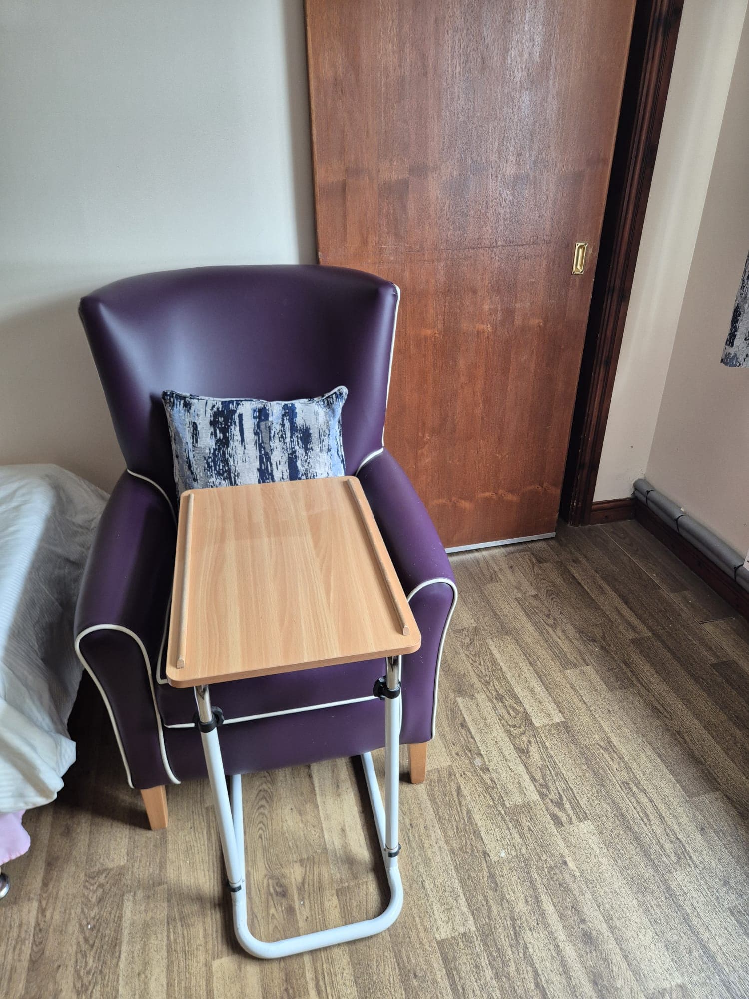 A homely resident bedroom with soft furnishings