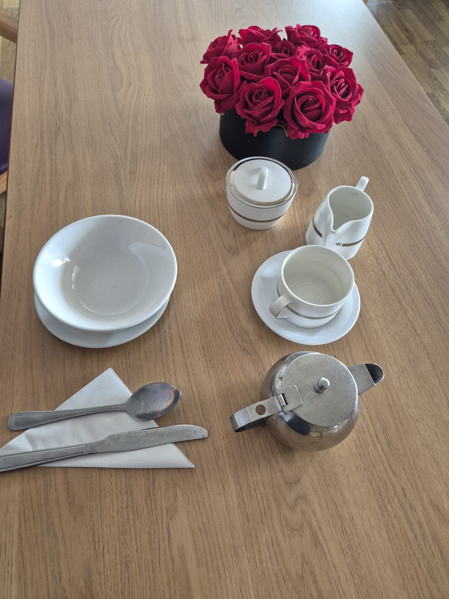 A dining table set in a communal area